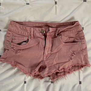 Distressed pink denim shorts